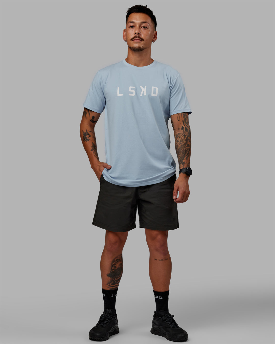 Man wearing 7&quot; Daily Shorts - Pirate Black | Model:Jemile | Size:M