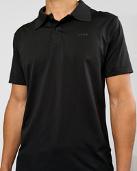 Man wearing Drive Seamless Polo - Black | Model:Leandro | Size:M