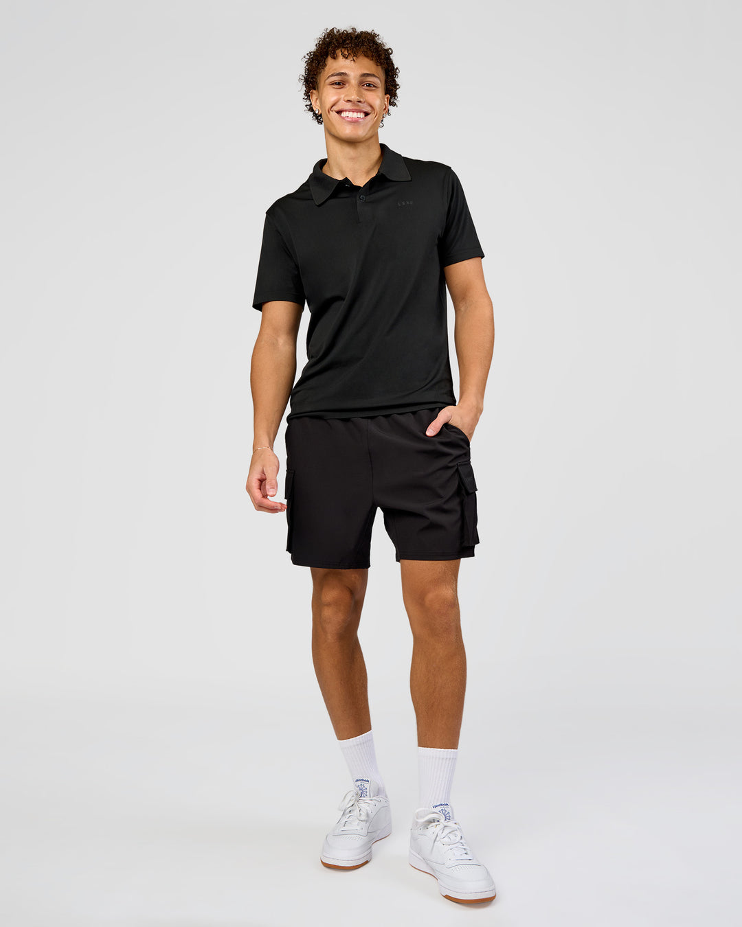 Man wearing Drive Seamless Polo - Black | Model:Leandro | Size:M