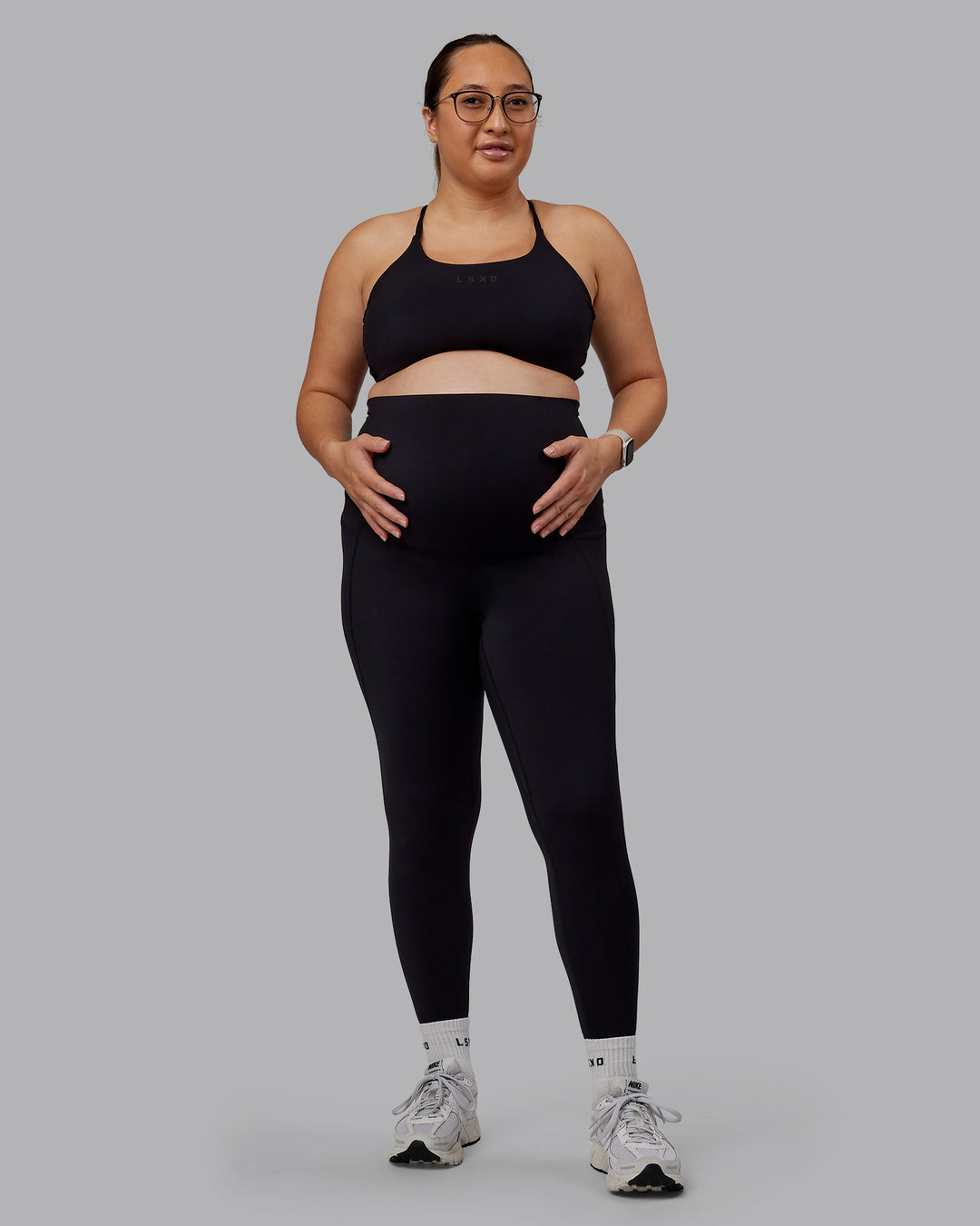 Woman wearing Elixir Ultra High-Rise Maternity Full Length Legging Pockets - Black | Model:Nevada | Size:M