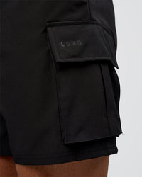 Man wearing Energy Stretch 6" Performance Cargo Short - Black | Model:Daarian | Size:M