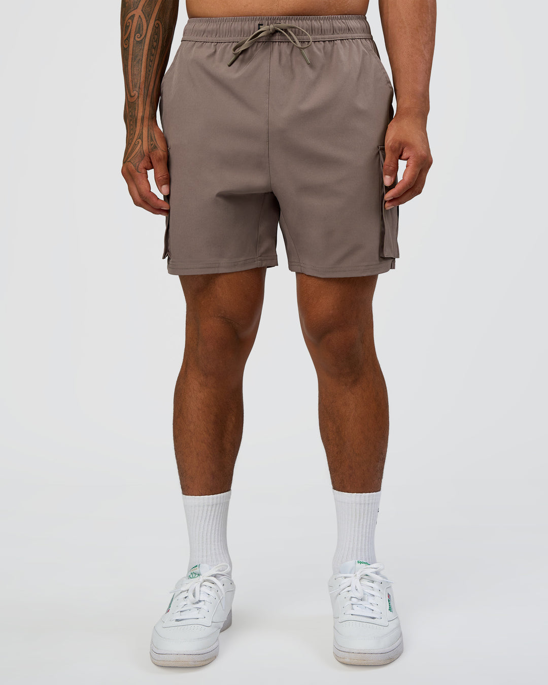 Man wearing Energy Stretch 6" Performance Cargo Short - Iron | Model:Daarian | Size:M