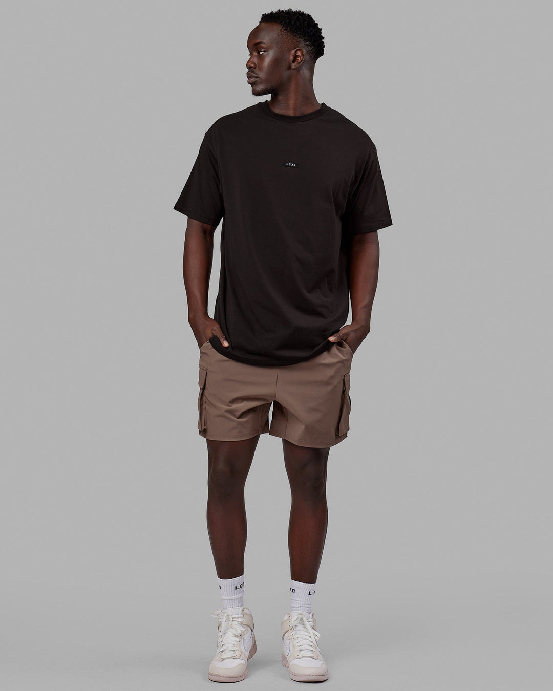 Man wearing Energy Stretch Performance Cargo Short - Deep Taupe