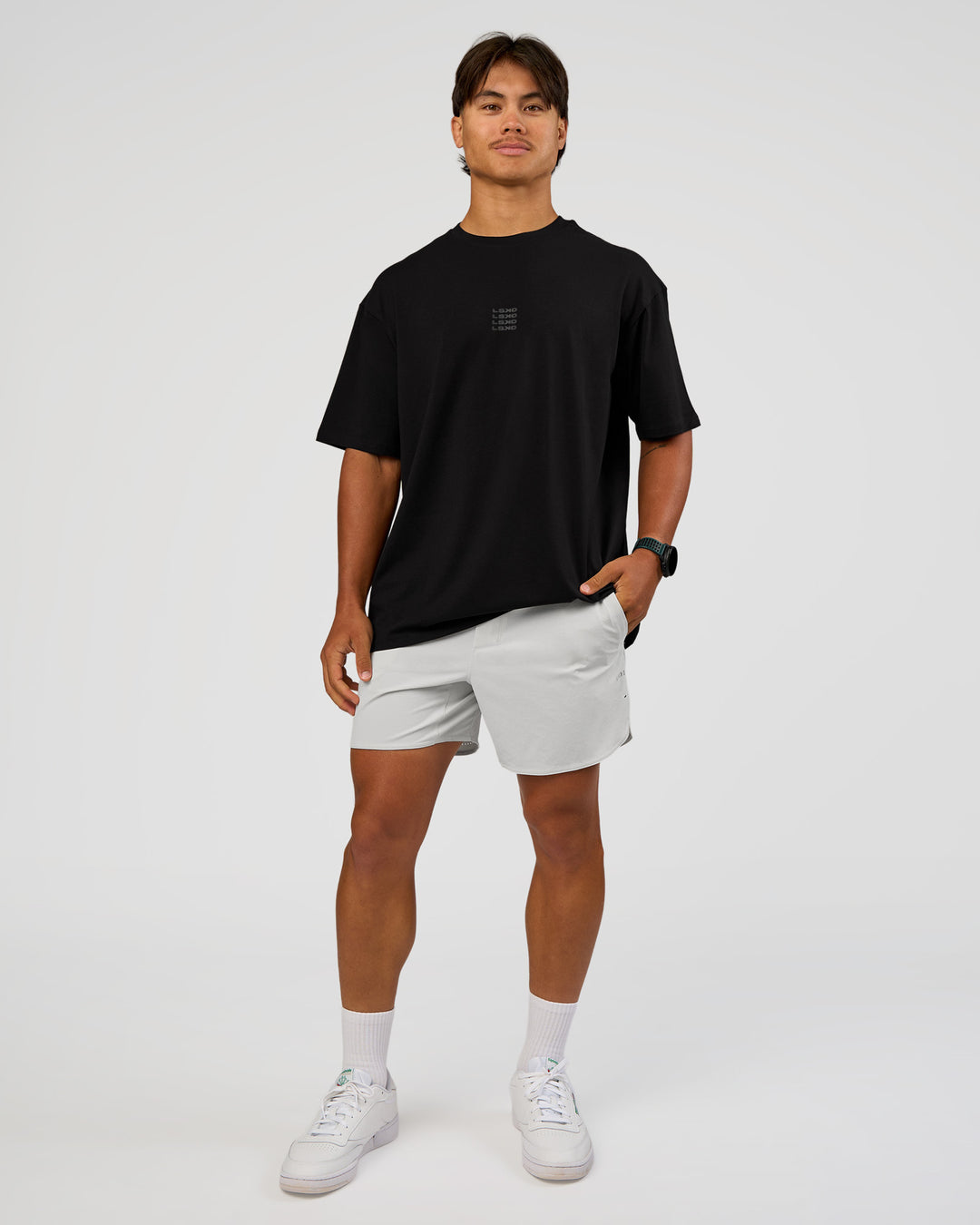 Man wearing Everyday Elevation FLXCotton Oversized Tee - Black-Black | Model:George | Size:M