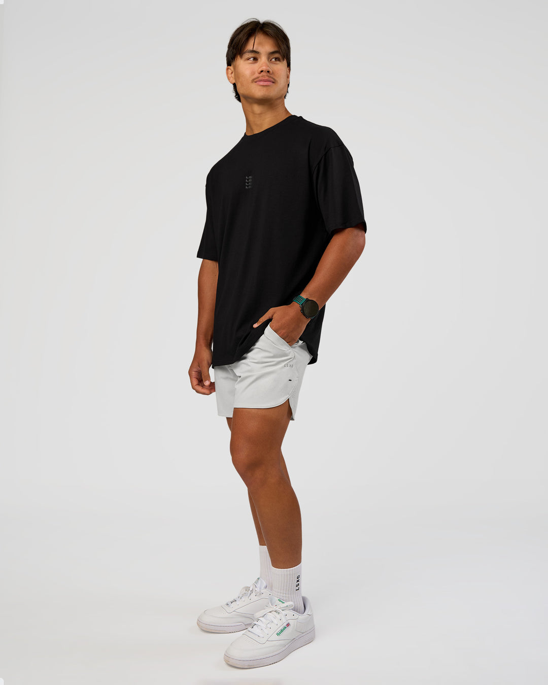 Man wearing Everyday Elevation FLXCotton Oversized Tee - Black-Black | Model:George | Size:M