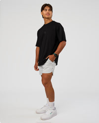 Man wearing Everyday Elevation FLXCotton Oversized Tee - Black-Black | Model:George | Size:M