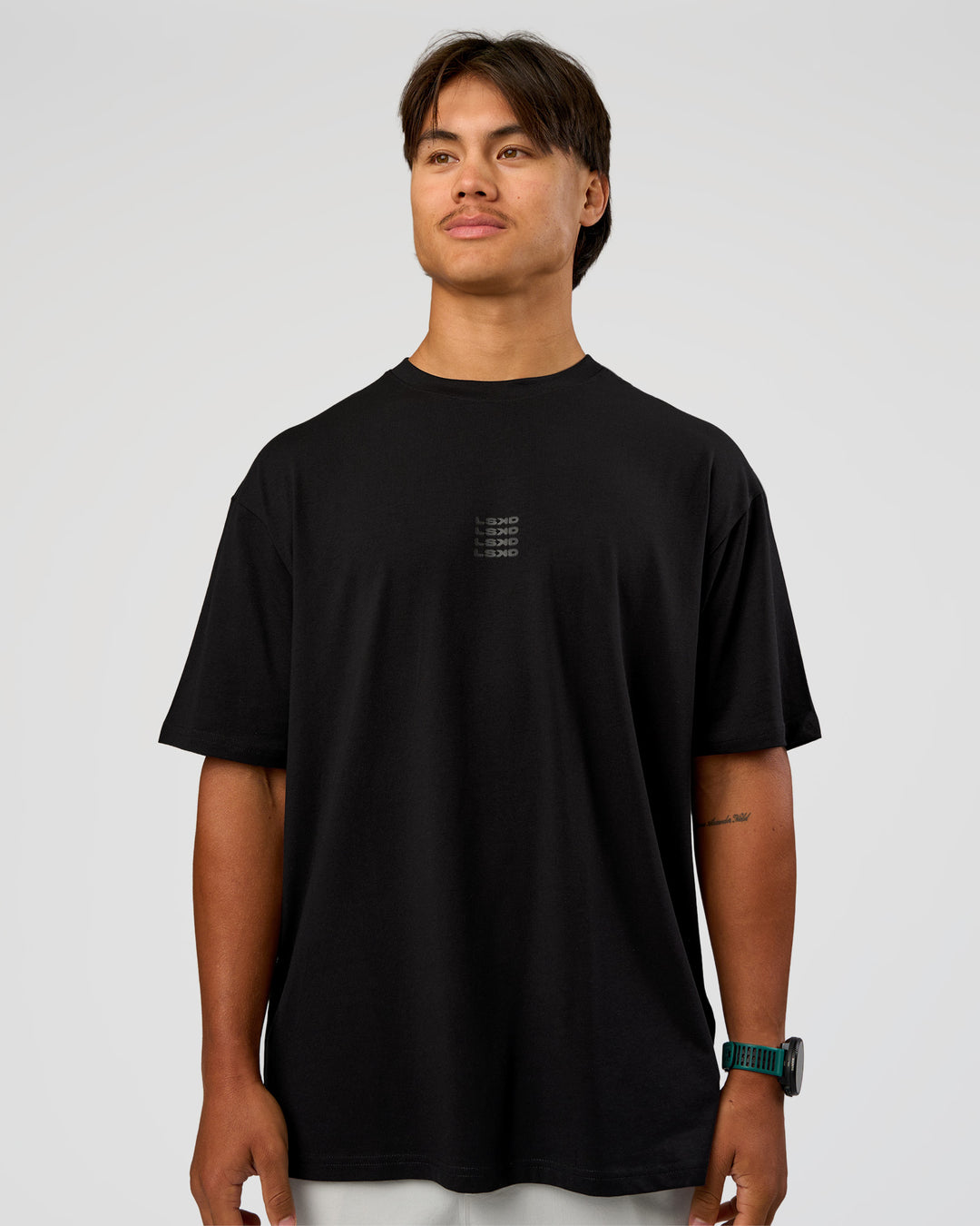 Man wearing Everyday Elevation FLXCotton Oversized Tee - Black-Black | Model:George | Size:M