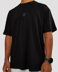 Man wearing Everyday Elevation FLXCotton Oversized Tee - Black-Black | Model:George | Size:M