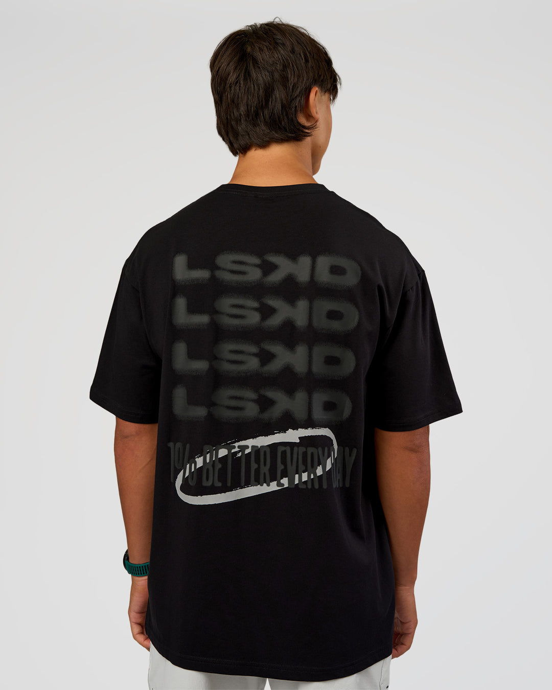 Man wearing Everyday Elevation FLXCotton Oversized Tee - Black-Black | Model:George | Size:M