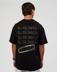 Man wearing Everyday Elevation FLXCotton Oversized Tee - Black-Black | Model:George | Size:M