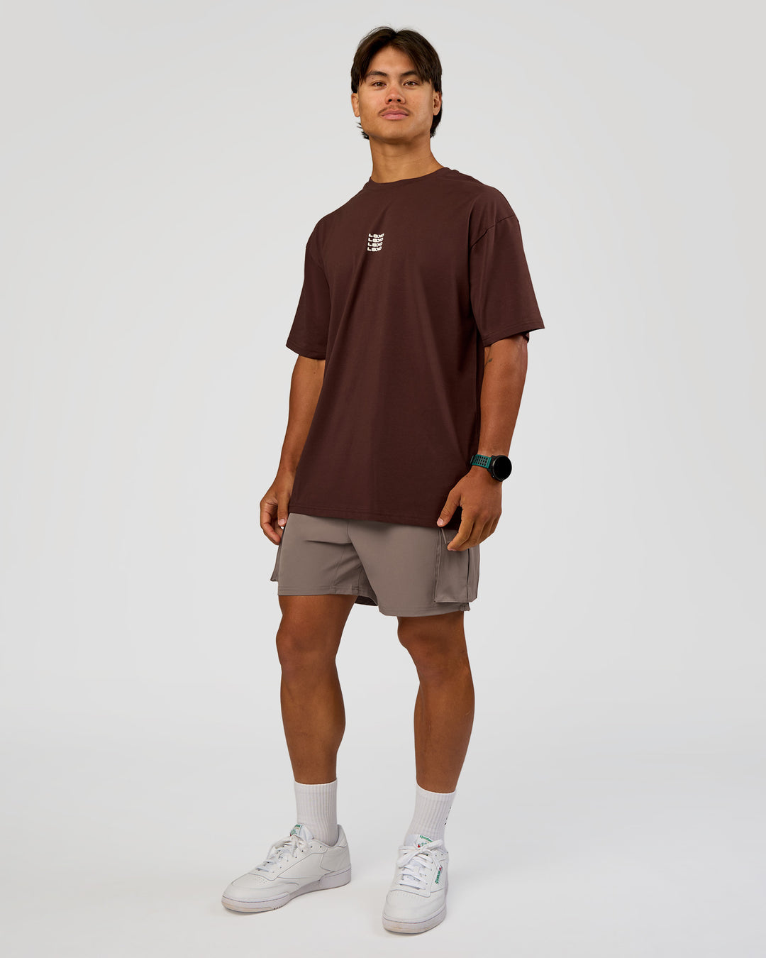Man wearing Everyday Elevation FLXCotton Oversized Tee - Hot Chocolate-Off White | Model:George | Size:M