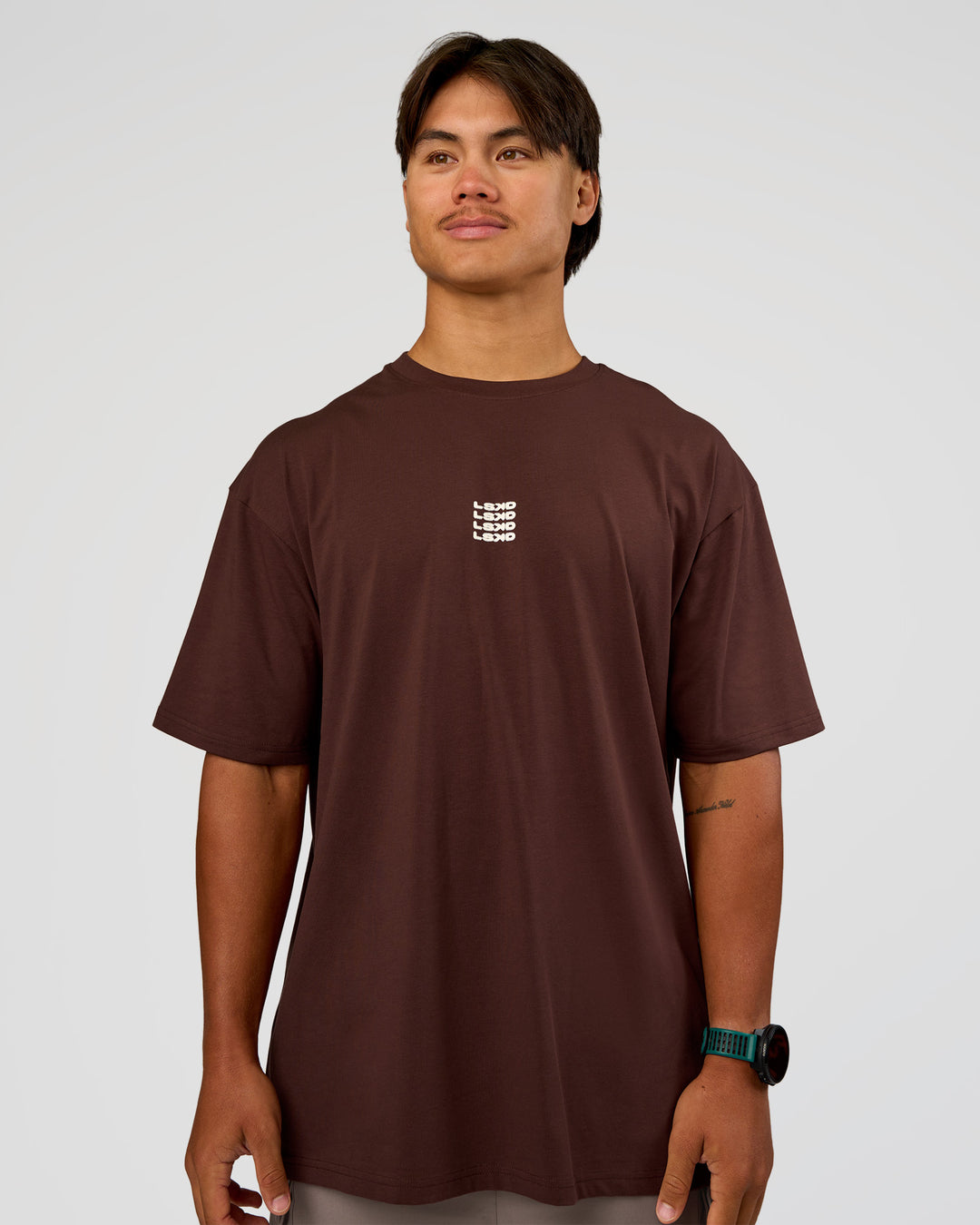 Man wearing Everyday Elevation FLXCotton Oversized Tee - Hot Chocolate-Off White | Model:George | Size:M