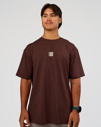 Man wearing Everyday Elevation FLXCotton Oversized Tee - Hot Chocolate-Off White | Model:George | Size:M