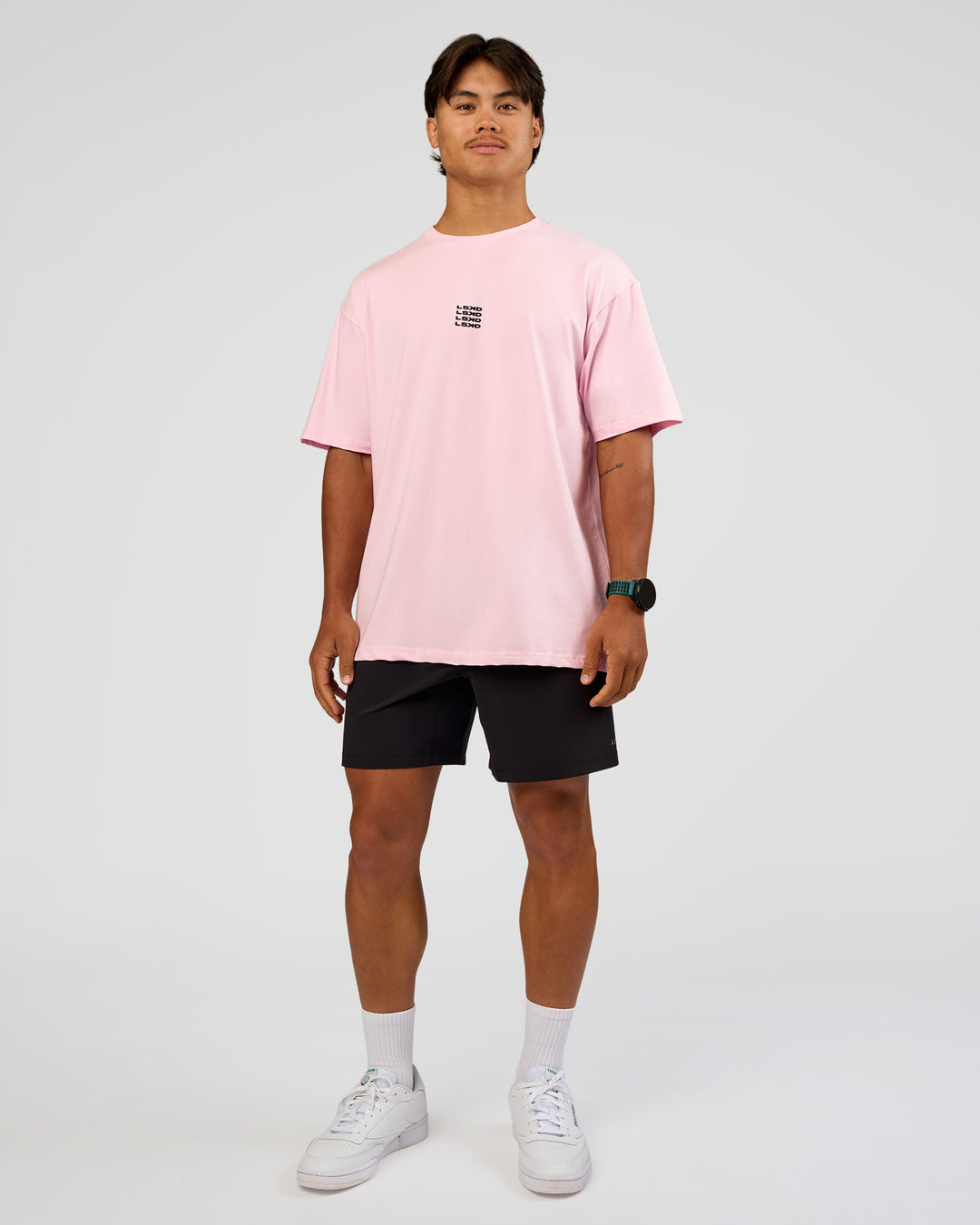 Man wearing Everyday Elevation FLXCotton Oversized Tee - Marshmallow-Black | Model:George | Size:M
