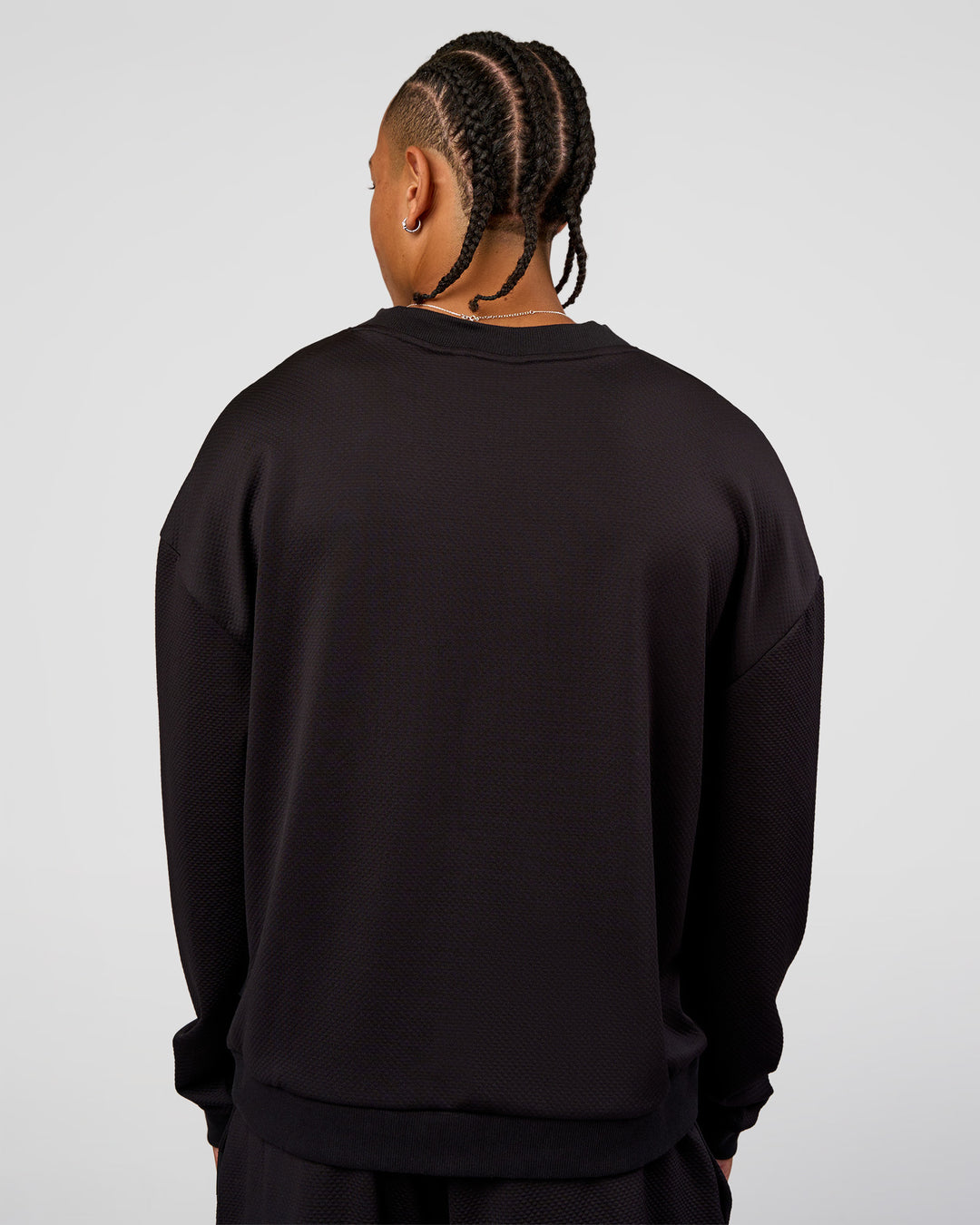 Man wearing Everyday Elevation Waffle Oversized Sweater - Black | Model:Malebo | Size:M