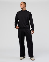 Man wearing Everyday Elevation Waffle Wide Leg Pant - Black | Model:Albert | Size:M
