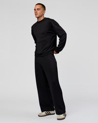 Man wearing Everyday Elevation Waffle Wide Leg Pant - Black | Model:Albert | Size:M