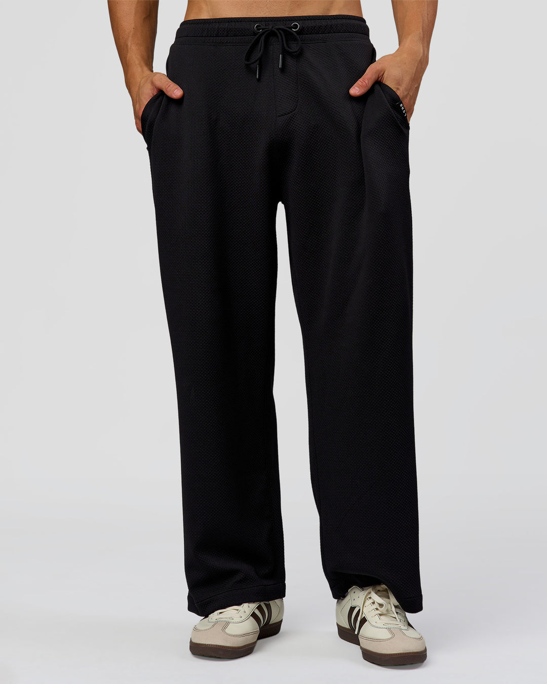Man wearing Everyday Elevation Waffle Wide Leg Pant - Black | Model:Albert | Size:M
