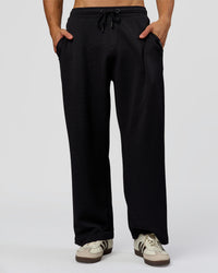 Man wearing Everyday Elevation Waffle Wide Leg Pant - Black | Model:Albert | Size:M