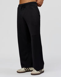 Man wearing Everyday Elevation Waffle Wide Leg Pant - Black | Model:Albert | Size:M