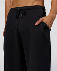Man wearing Everyday Elevation Waffle Wide Leg Pant - Black | Model:Albert | Size:M