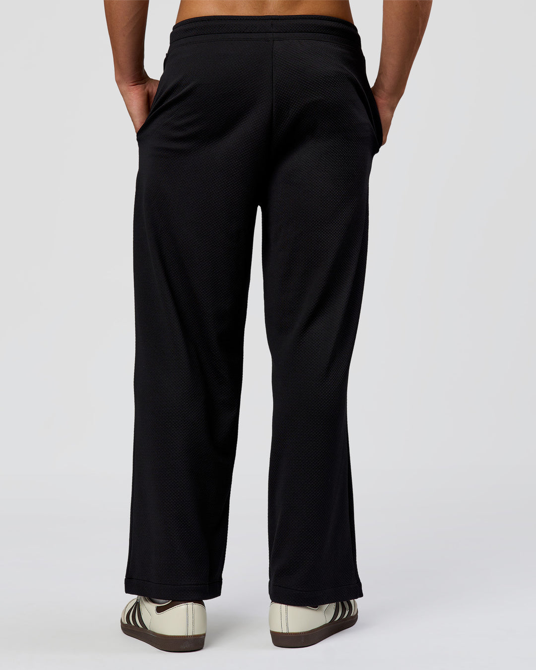 Man wearing Everyday Elevation Waffle Wide Leg Pant - Black | Model:Albert | Size:M