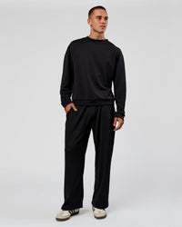 Man wearing Everyday Elevation Waffle Wide Leg Pant - Black | Model:Albert | Size:M