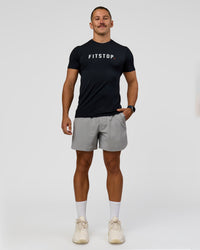 Man wearing Fitstop AeroFLX+ Seamless Tee - Black | Model:Jaiden | Size:M