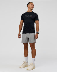 Man wearing Fitstop AeroFLX+ Seamless Tee - Black | Model:Jaiden | Size:M