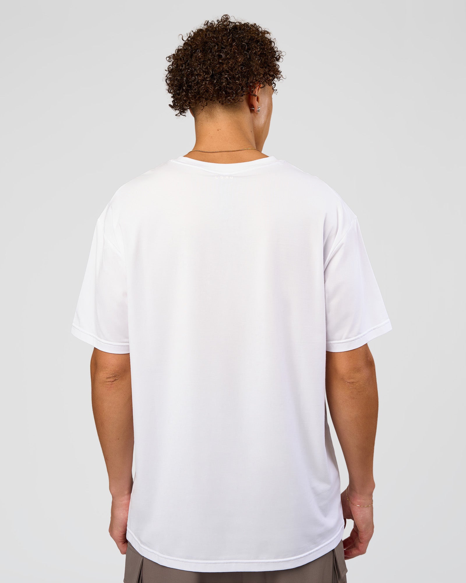 Man wearing Forever EffortlessTech Tee - White | Model:Leandro | Size:M