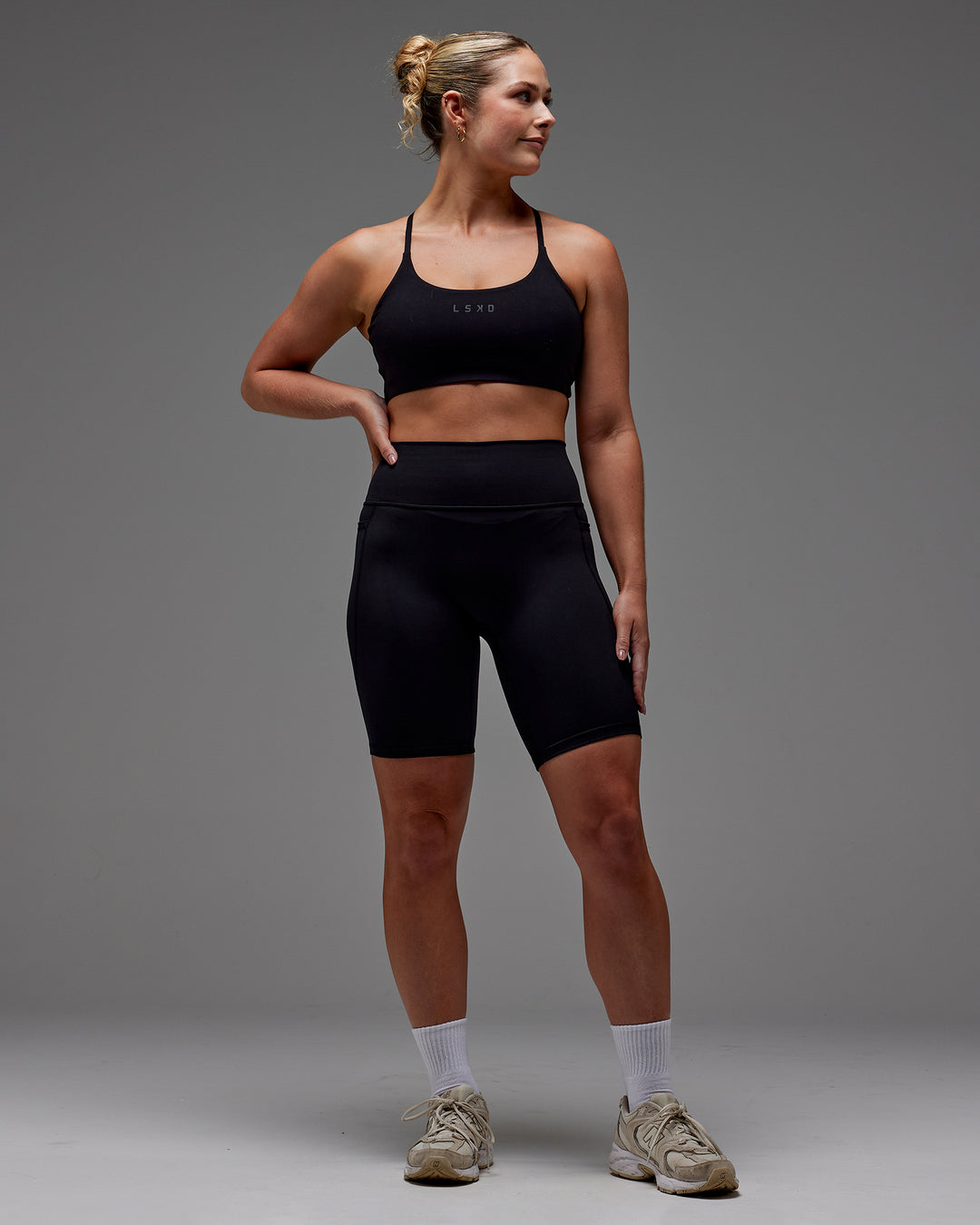 Woman wearing Fusion Bike Short With Pockets in Black | Model:Meg | Size:M