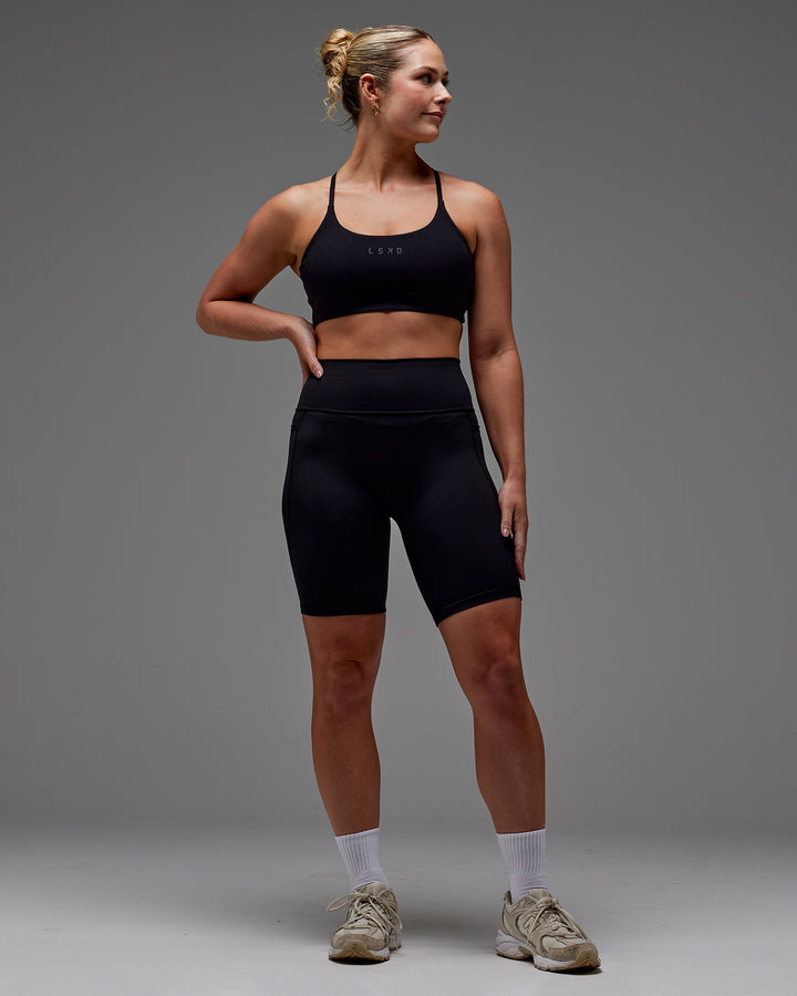 Woman wearing Fusion Bike Short With Pockets in Black | Model:Meg | Size:M
