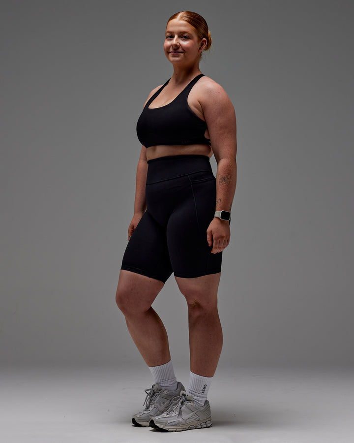Woman wearing Fusion Bike Short With Pockets in Black | Model:Caity | Size:M
