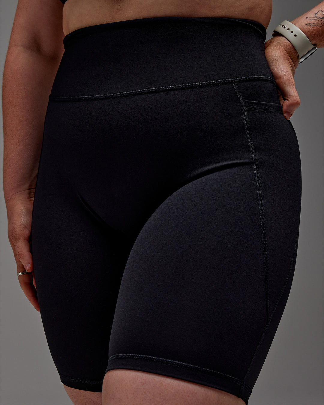 Woman wearing Fusion Ultra High-Rise 9&quot; Short Pockets - Black | Model:Caity | Size:M