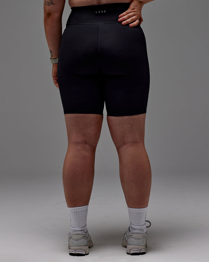 Woman wearing Fusion Bike Short With Pockets in Black | Model:Caity | Size:M
