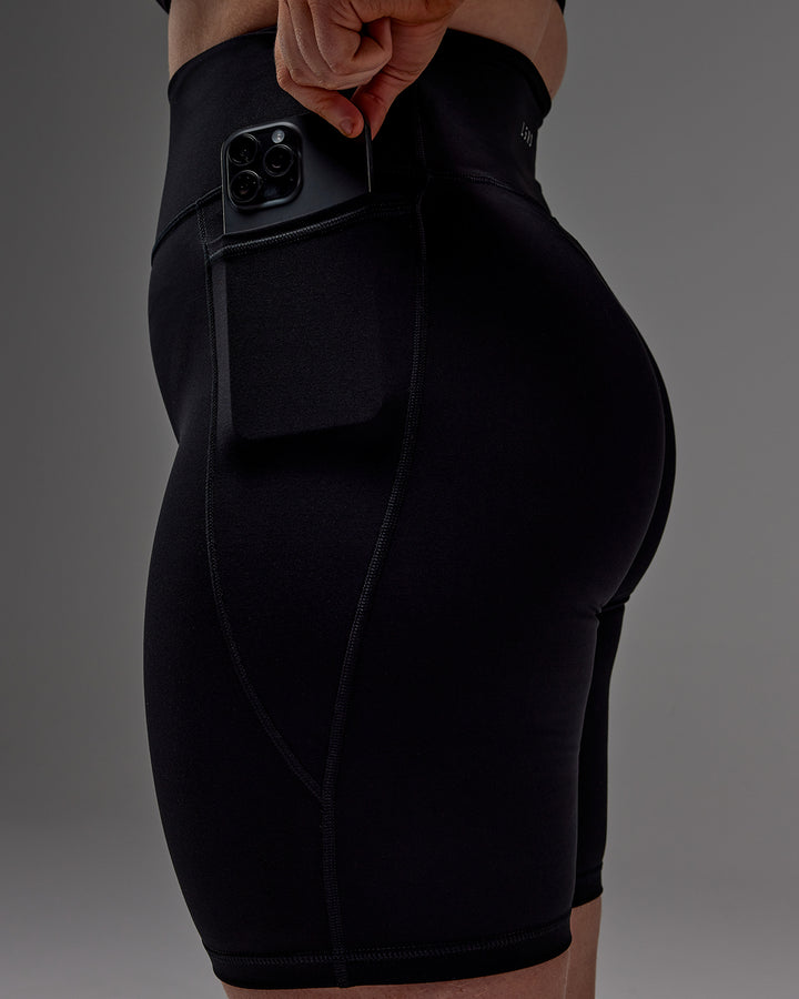 Woman wearing Fusion Bike Short With Pockets in Black | Model:Caity | Size:M
