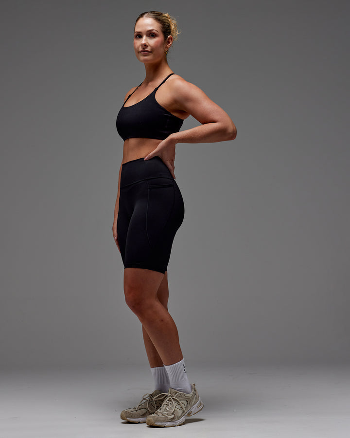 Woman wearing Fusion Bike Short With Pockets in Black | Model:Meg | Size:M
