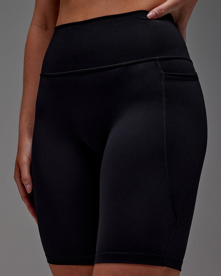 Woman wearing Fusion Bike Short With Pockets in Black | Model:Meg | Size:M
