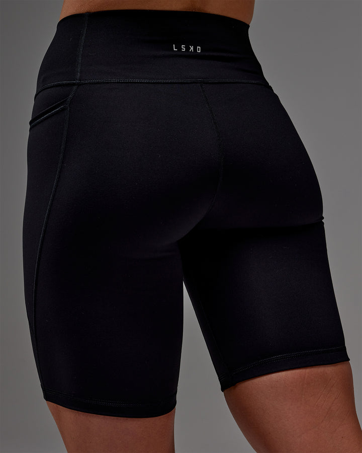 Woman wearing Fusion Bike Short With Pockets in Black | Model:Meg | Size:M
