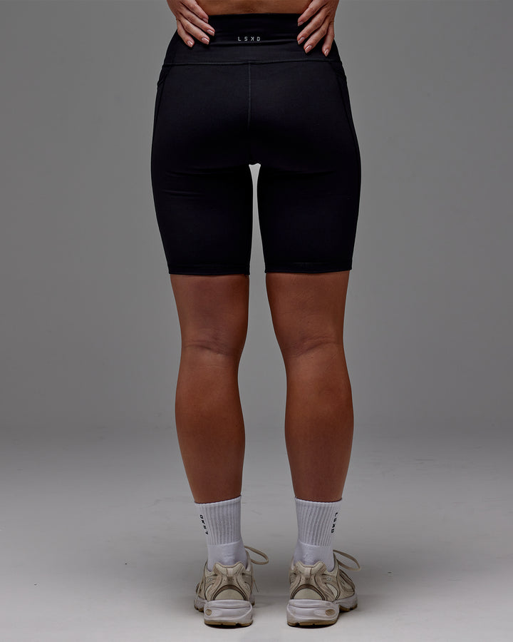 Woman wearing Fusion Bike Short With Pockets in Black | Model:Meg | Size:M
