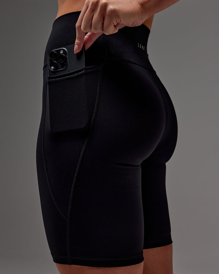 Woman wearing Fusion Bike Short With Pockets in Black | Model:Meg | Size:M
