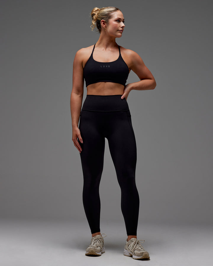 Woman wearing Fusion Full Length Tight With Pockets in Black | Model:Meg | Size:M
