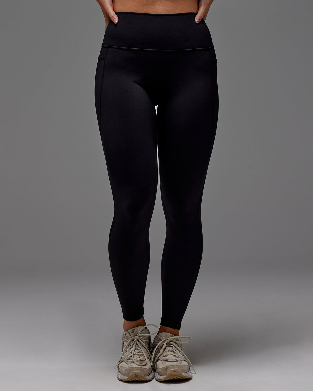 Woman wearing Fusion Full Length Tight With Pockets in Black | Model:Meg | Size:M