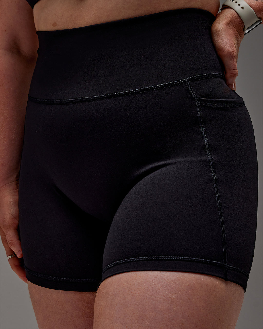 Woman wearing Fusion Ultra High-Rise 6&quot; Short Pockets - Black | Model:Caity | Size:M