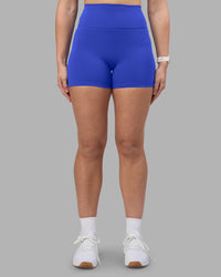 Woman wearing Fusion Ultra High-Rise 4" Short - Power Cobalt | Set:true | Angle:front | Model:Amy | Size:M