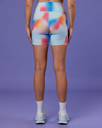 Woman wearing Fusion Ultra High-Rise 6" Short Pockets - Rainbow Shade | Set:true | Angle:back | Model:Mon | Size:M