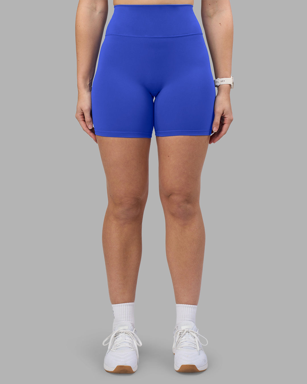 Woman wearing Fusion Ultra High-Rise 6&quot; Short - Power Cobalt | Model:Amy | Size:M