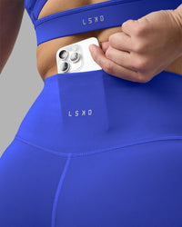 Woman wearing Fusion Ultra High-Rise 6" Short - Power Cobalt | Set:true | Angle:closeup | Model:Amy | Size:M
