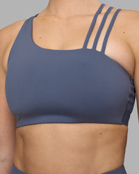 Woman wearing Galvanise Sports Bra 2.0 - Night Shadow | Set:true | Angle:closeup | Model:Amy | Size:M