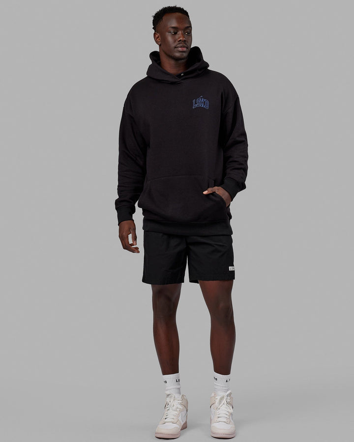 Man wearing Unisex Guild Hoodie Oversize - Black